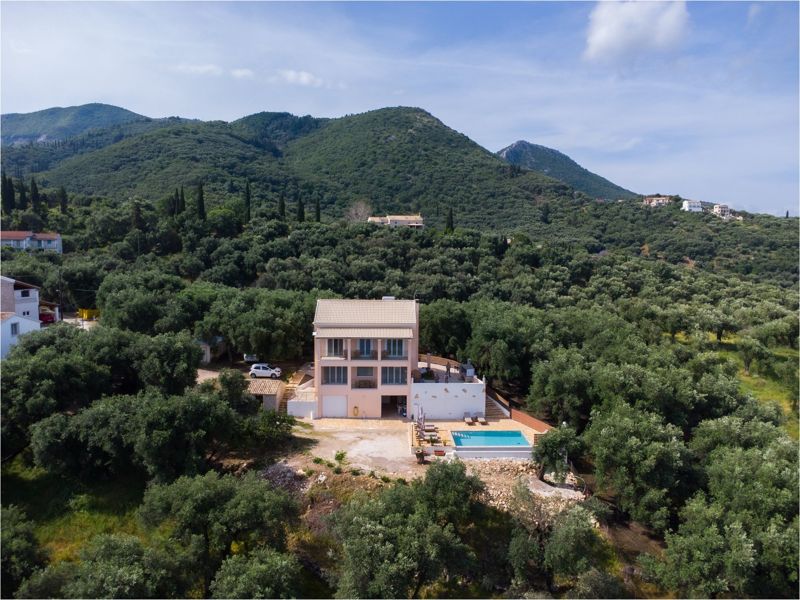 The villa with mountain backdrop
