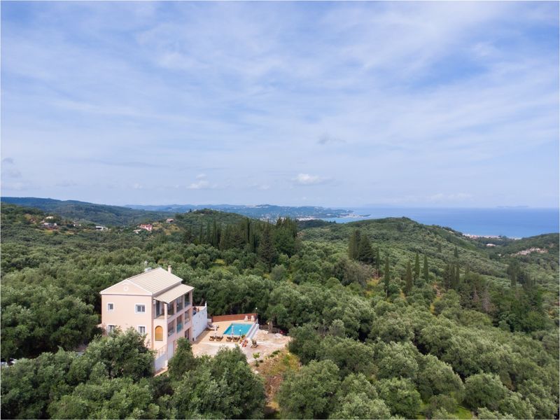 The villa with the sea in the distance