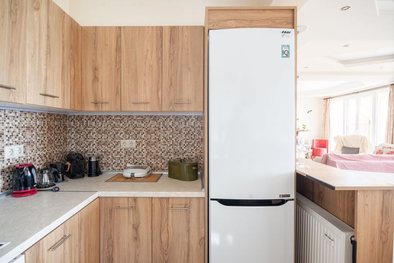 Kitchen with dishwasher and fridge