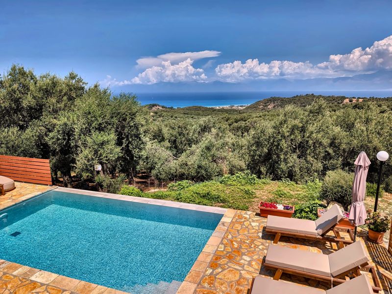 Pool overlooking the olive groves and the sea